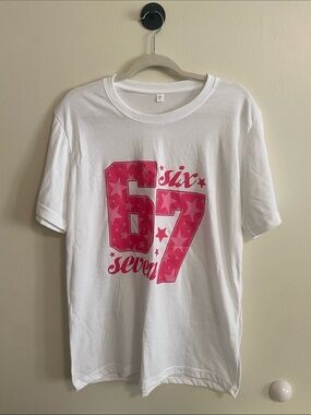 White Graphic Tee with Pink "67" Star Design